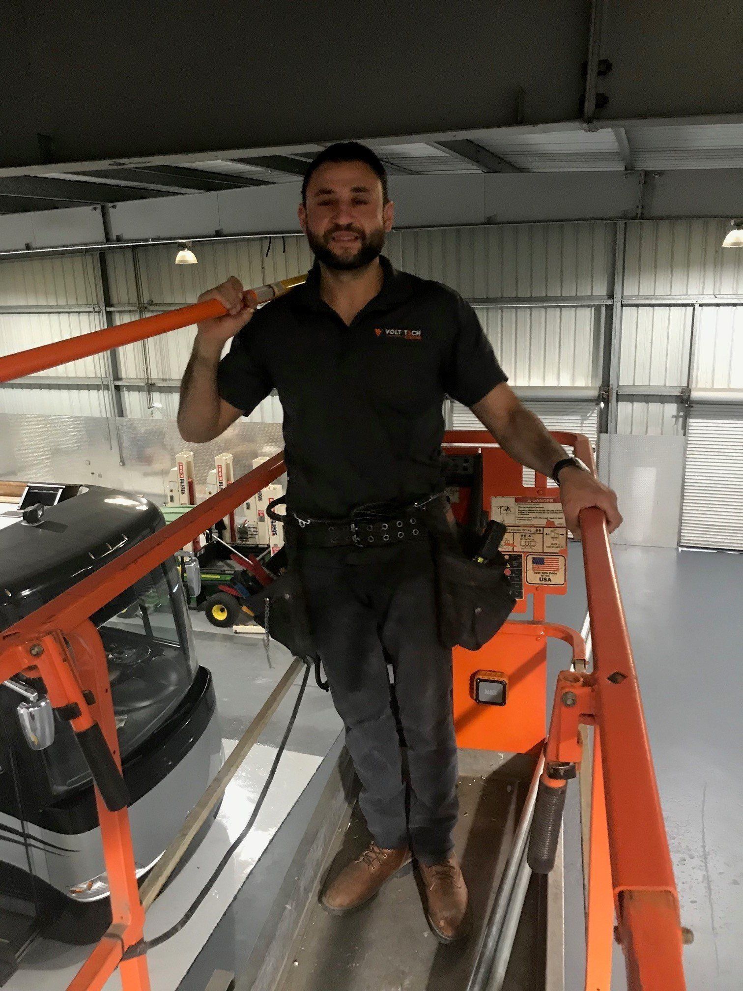 Man on a Electrical Scissor Lift — Riverside, CA — Volt Tech Electric