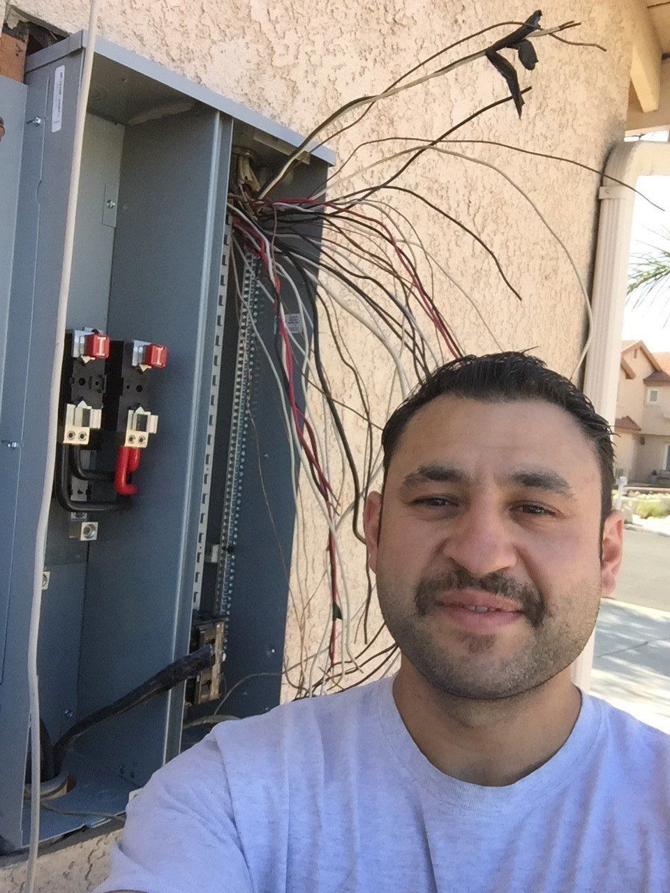 Self Portrait of Electrician Near a Circuit Breaker — Riverside, CA — Volt Tech Electric