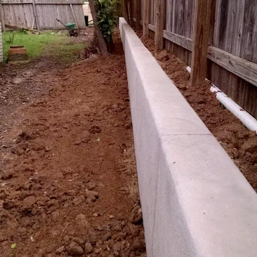 Outdoor dining set on a patio: wooden table with six wicker chairs, dishes set, white floral bowl.