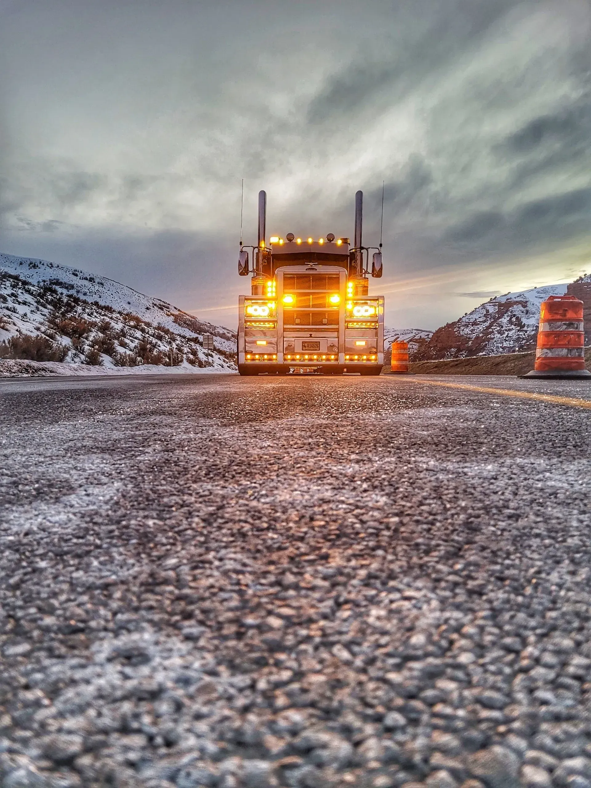 A semi truck is parked on the side of a snowy road — Evanston, WY — Robertson Transportation Inc. Towing and Recovery