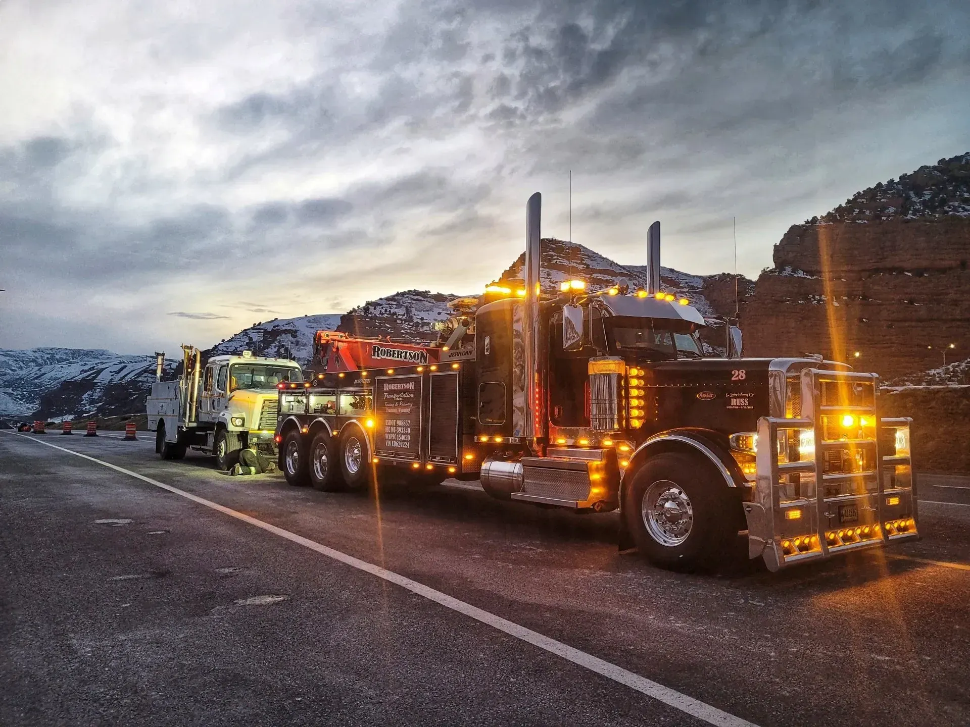 A tow truck is parked on the side of the road — Evanston, WY — Robertson Transportation Inc. Towing and Recovery