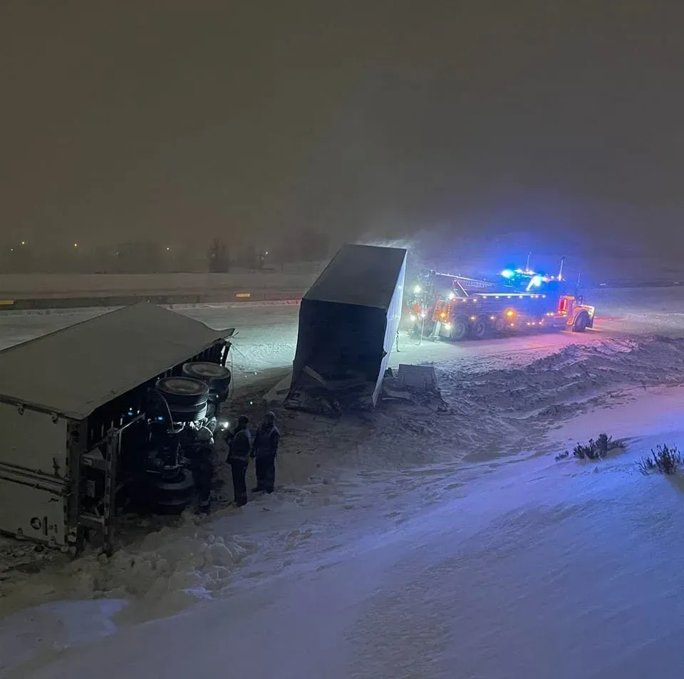 A truck has fallen off the road in the snow at night — Evanston, WY — Robertson Transportation Inc. Towing and Recovery