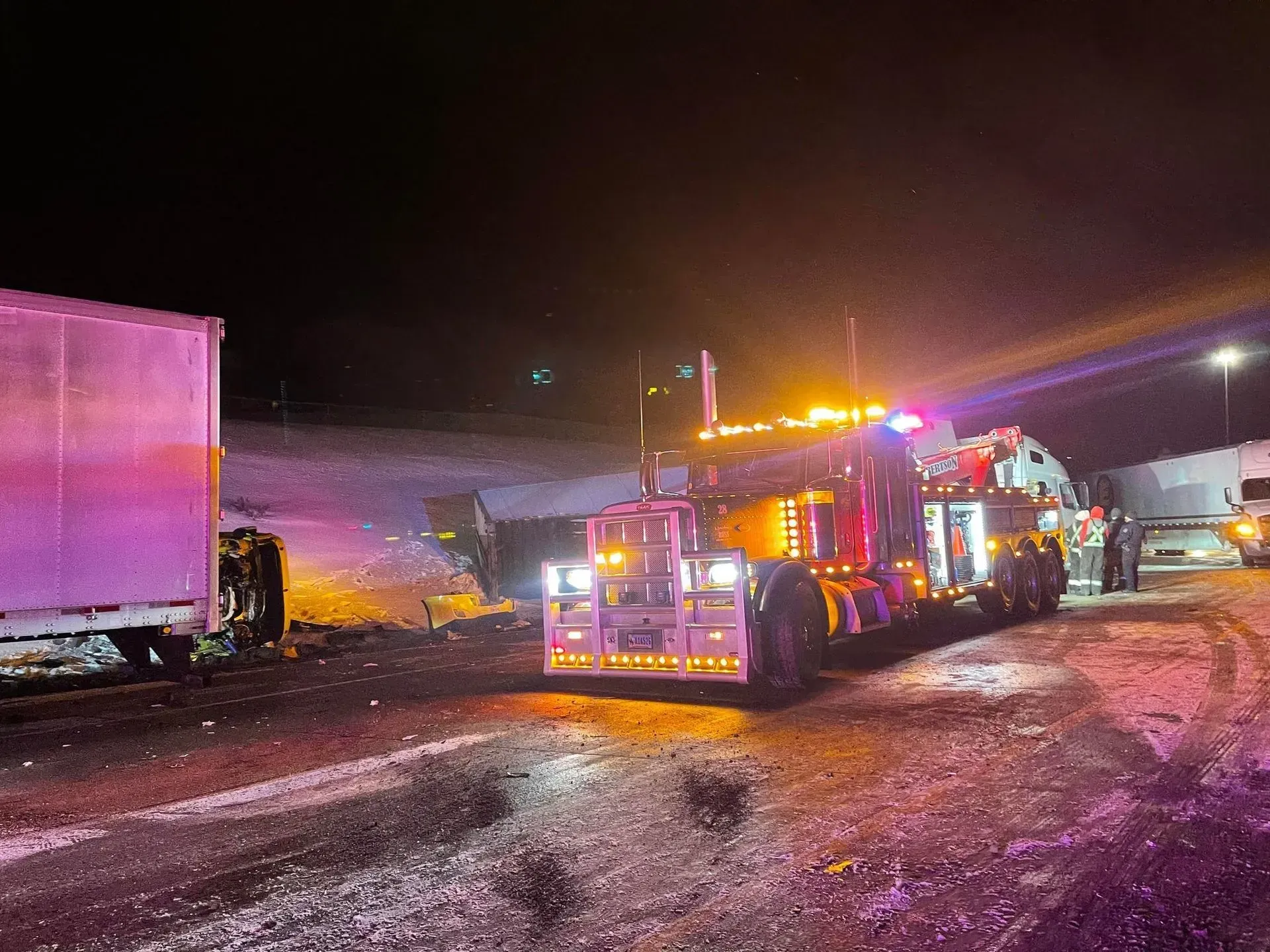 A fire truck is parked on the side of the road at night — Evanston, WY — Robertson Transportation Inc. Towing and Recovery