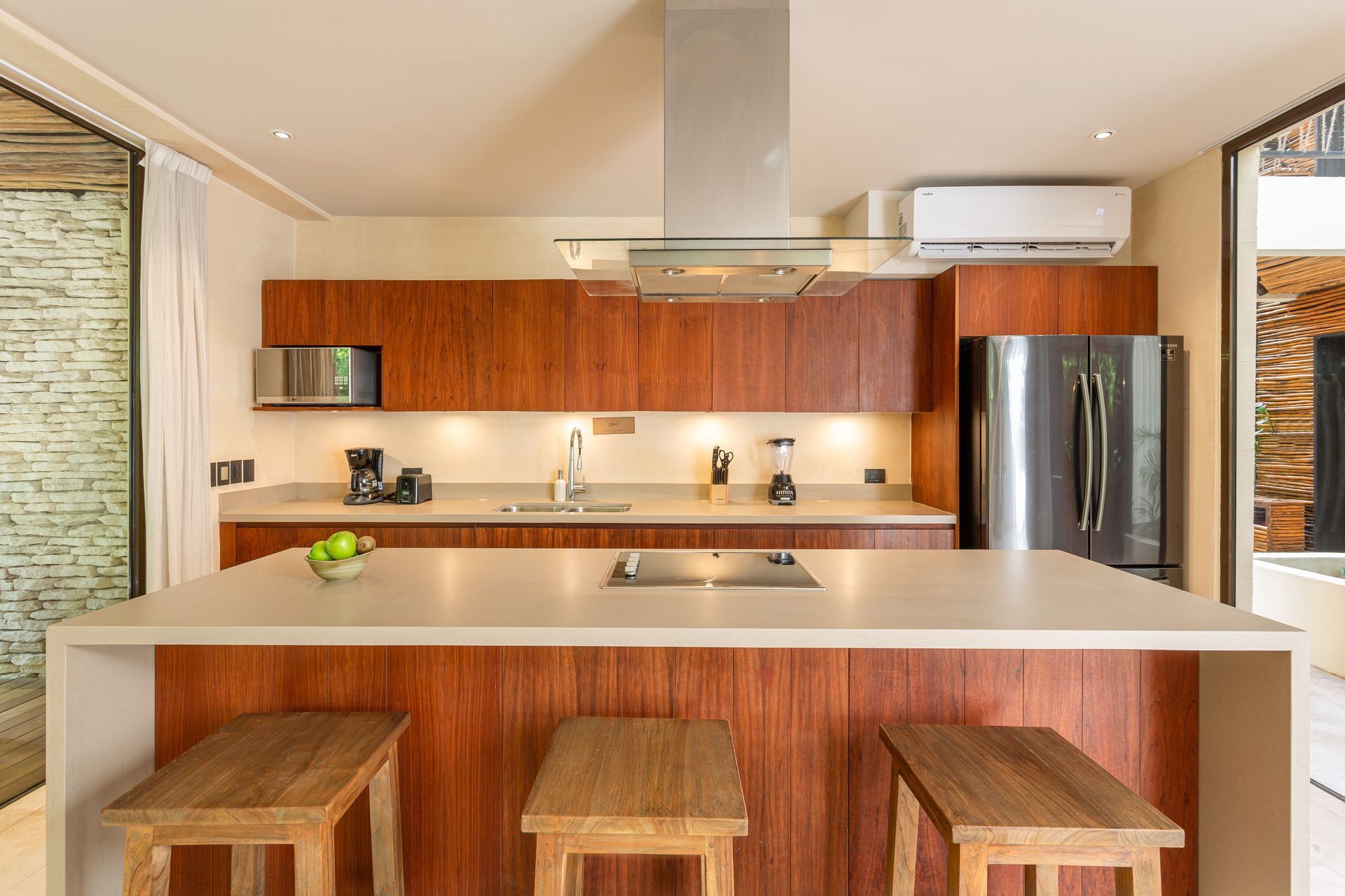 A kitchen with a large island and wooden cabinets
