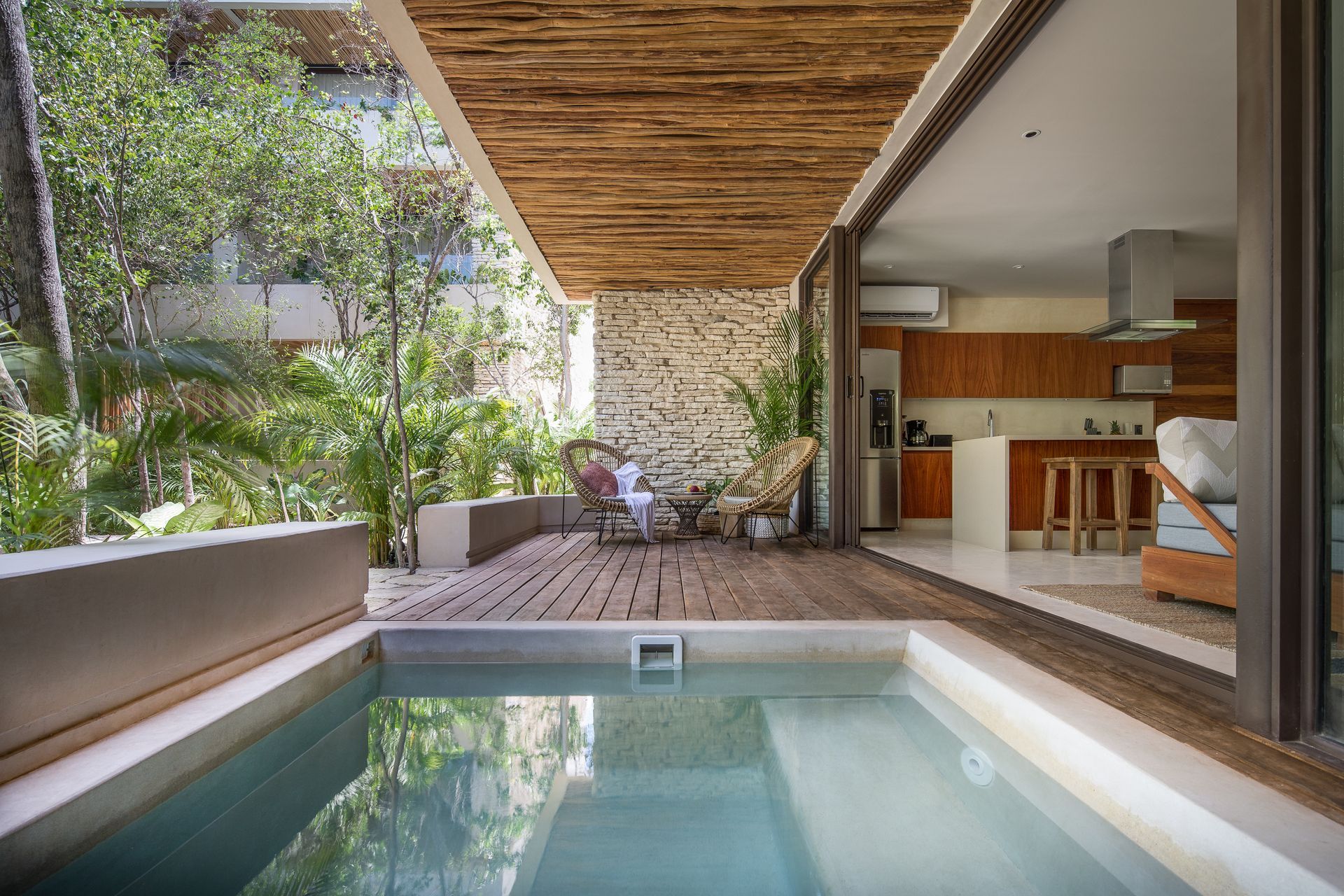 There is a large swimming pool in the middle of the house.