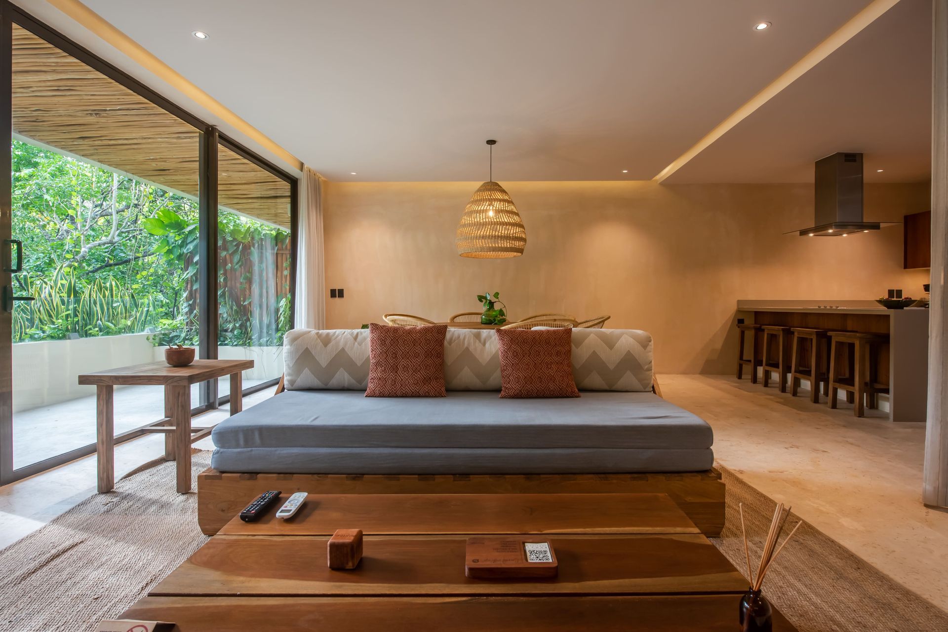 A living room with a couch and a wooden table.