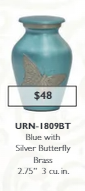 small blue keepsake urn with a butterfly