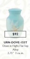 small blue keepsake urn with a dove
