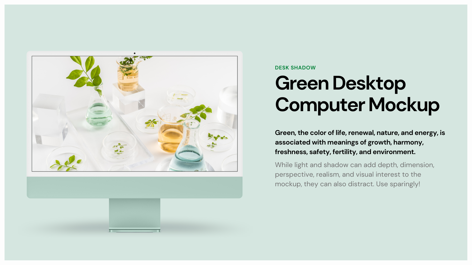 A green desktop computer mockup with a vase of flowers on the screen.