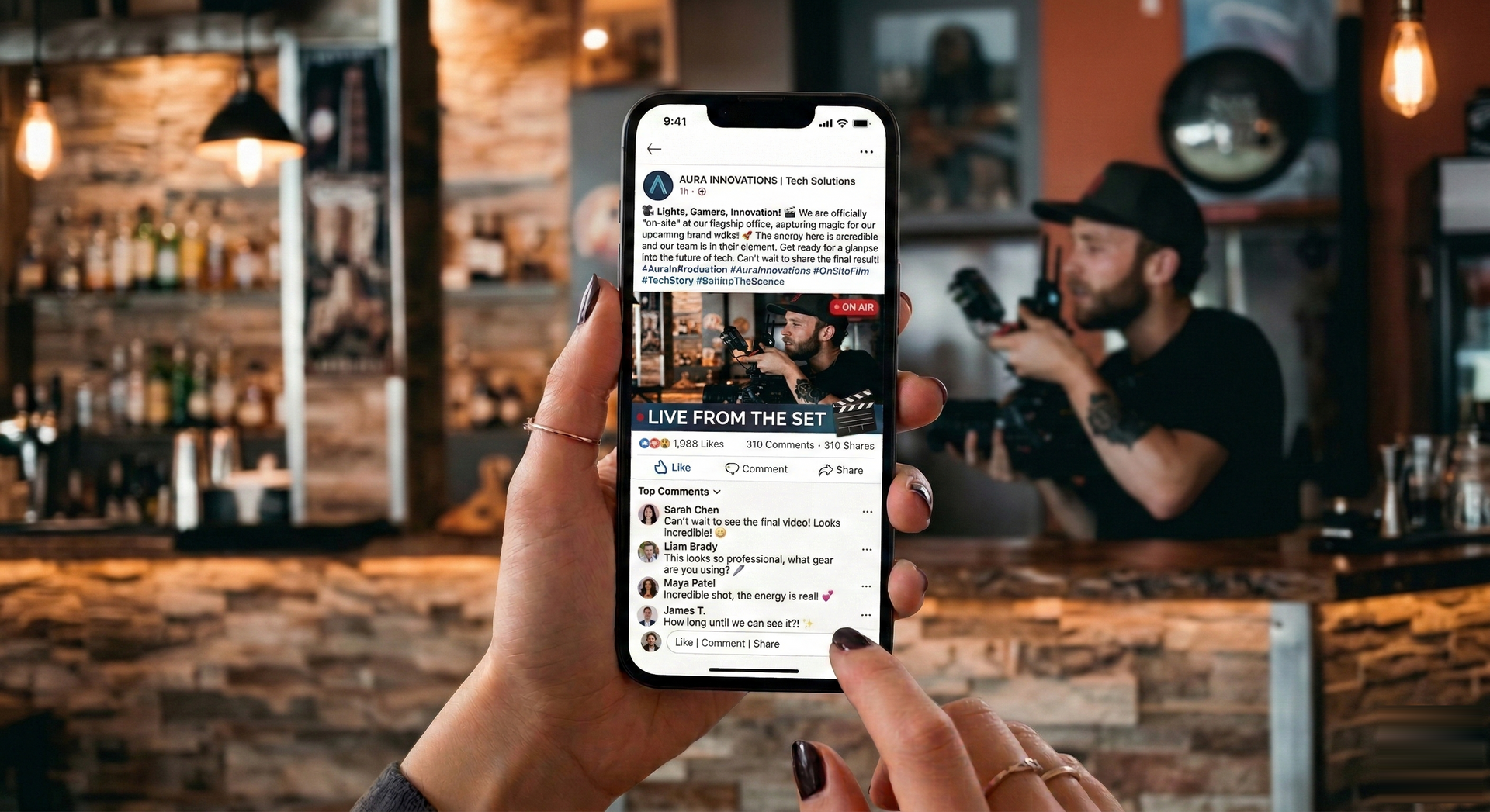 Person holds phone in bar, scrolling social media feed. Background includes bartender, bottles, and camera operator.