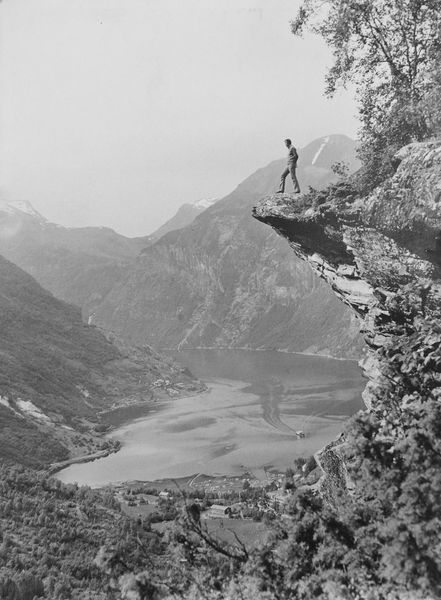 J. Douglas Thompson in his 30's standing on a cliff in Norway