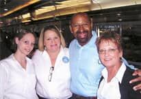 A group of people are posing for a picture on a bus.