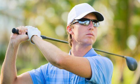 Individual playing golf