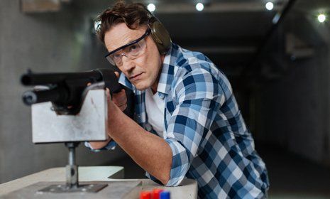Man wearing protective glasses for shooting