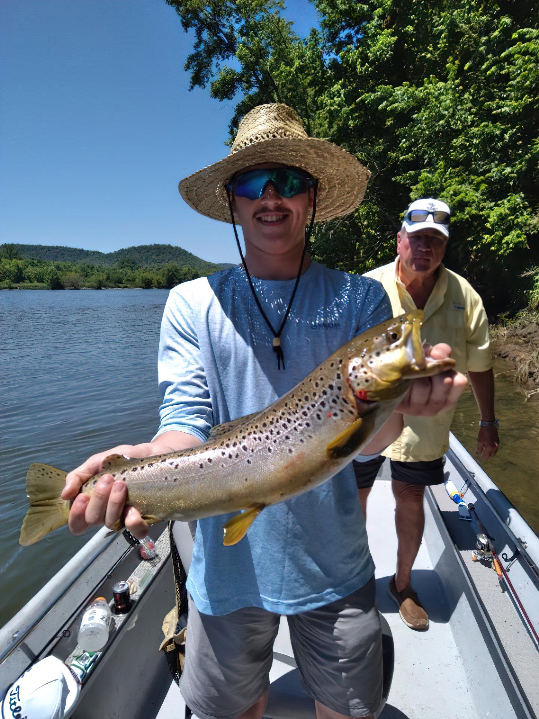 Angler with rainbow trout