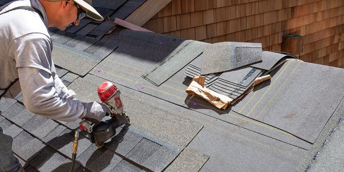 Worker Installing New Shingles — Jacksonville, FL — Triton Roofing and Restoration