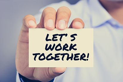 Hand holding a card with 