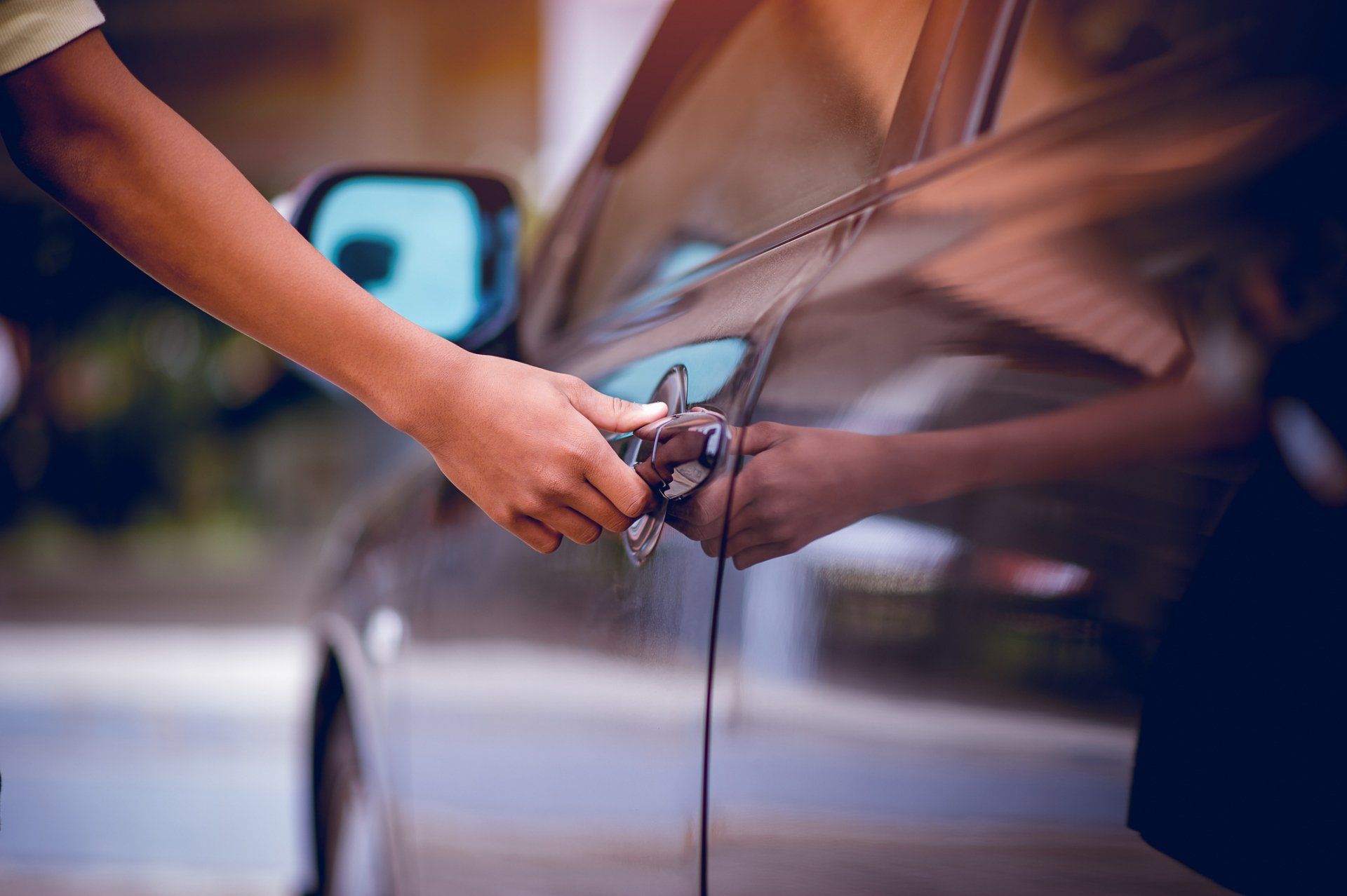 Person Opening a Car Door — West Palm Beach, FL — Palm Beach Parking