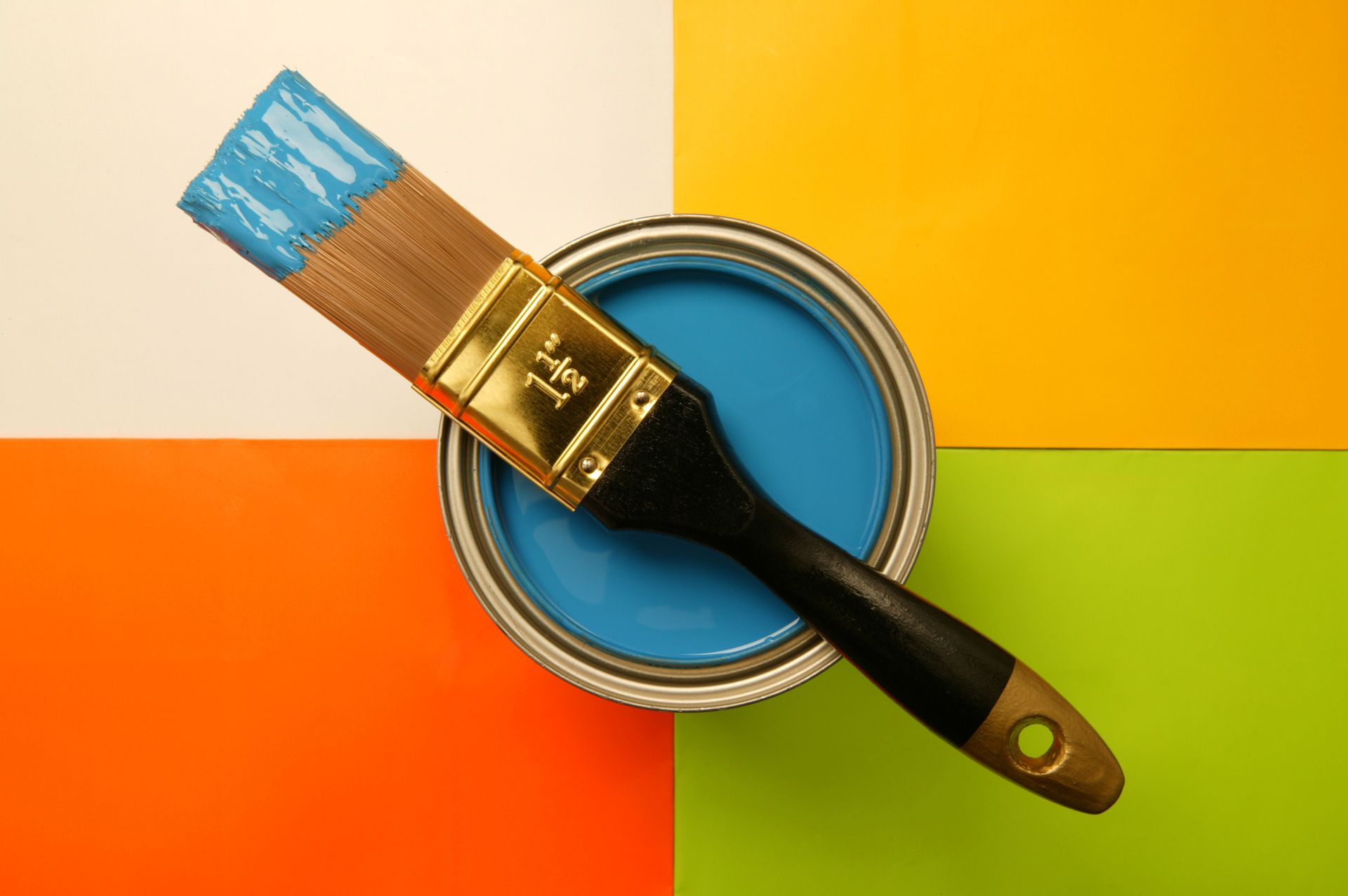 Close-up of paintbrush and paint can showcasing quality painting supplies.