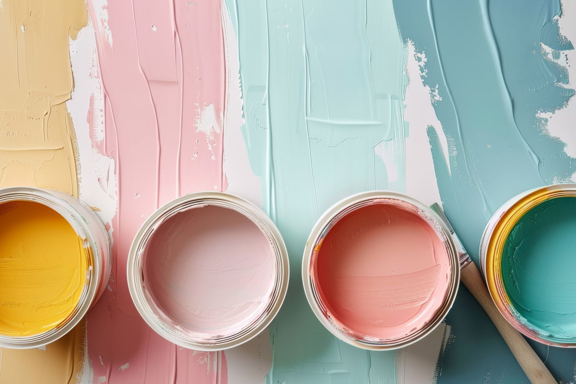 Pastel painting supplies: open cans of yellow, pink, and turquoise paint for home decor projects. Pastel painting supplies: open cans of yellow, pink, and turquoise paint for home decor projects.