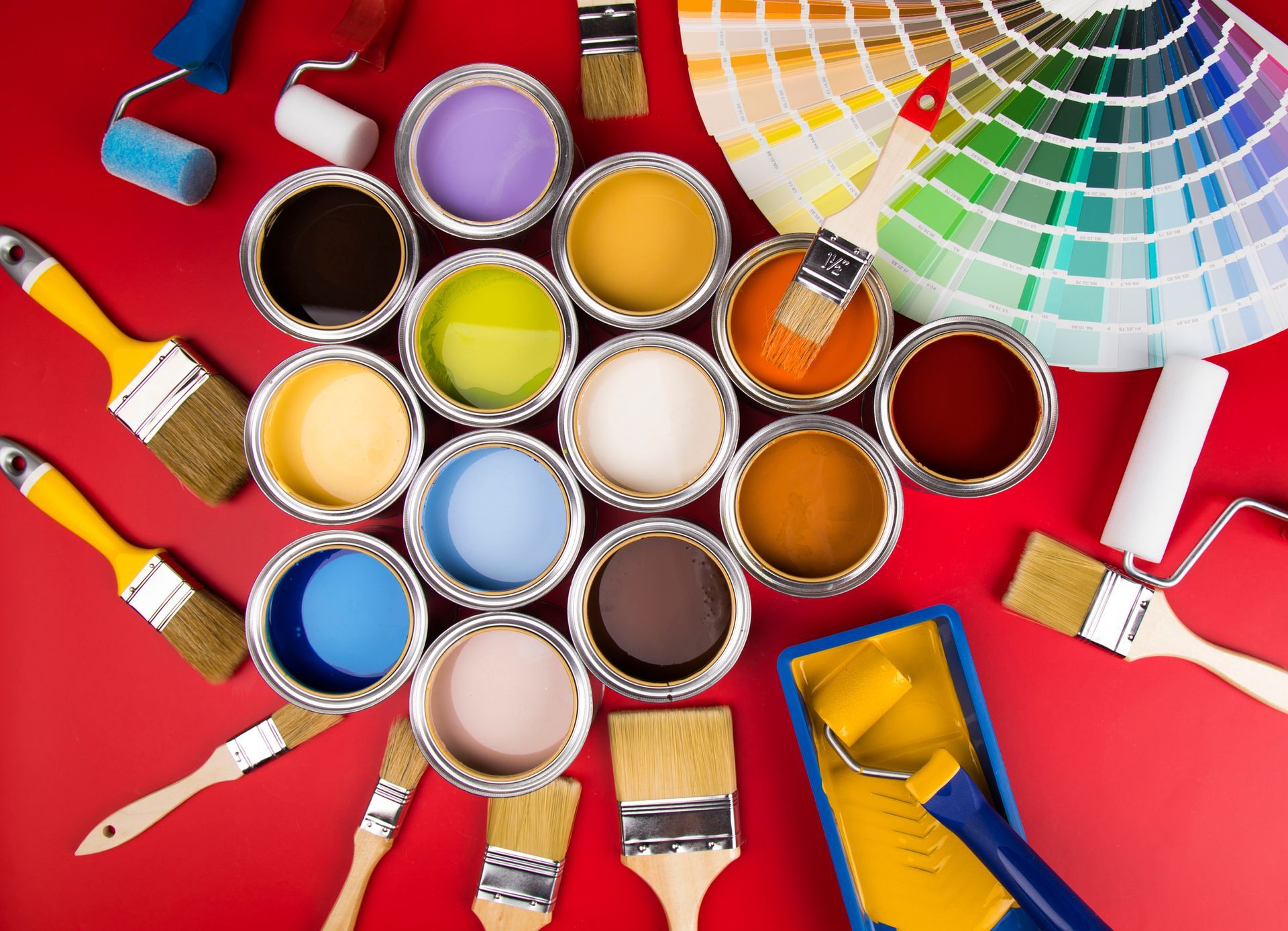 Open buckets with paint and brush showing essential painting supplies for projects.