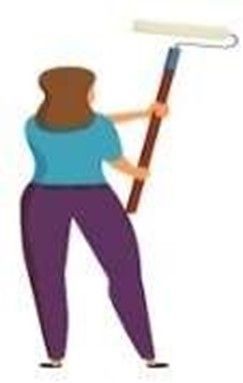 Woman in purple pants, painting a wall with a paint roller.