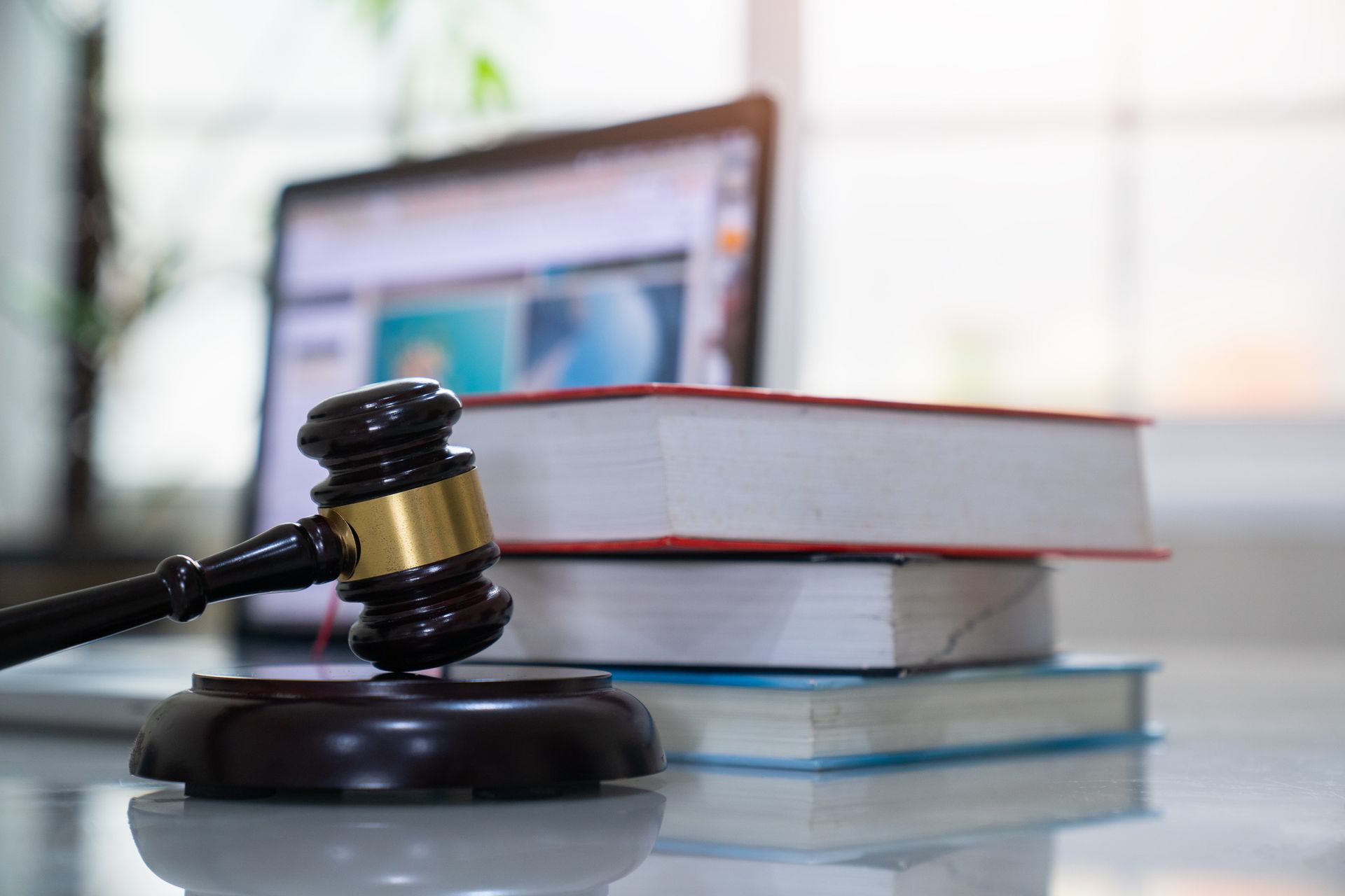 Judge gavel and legal book on wooden table, justice and law concept