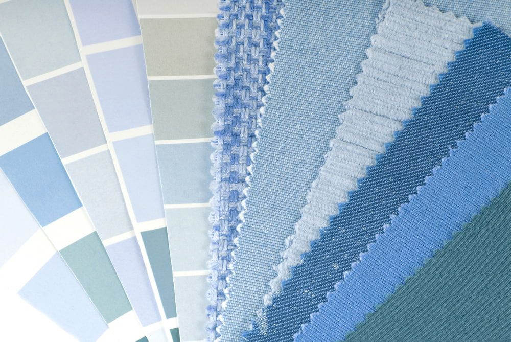 A Variety Of Blue Fabrics Are Stacked On Top Of Each Other — Summerland Screens & Awnings In Lennox Head, NSW