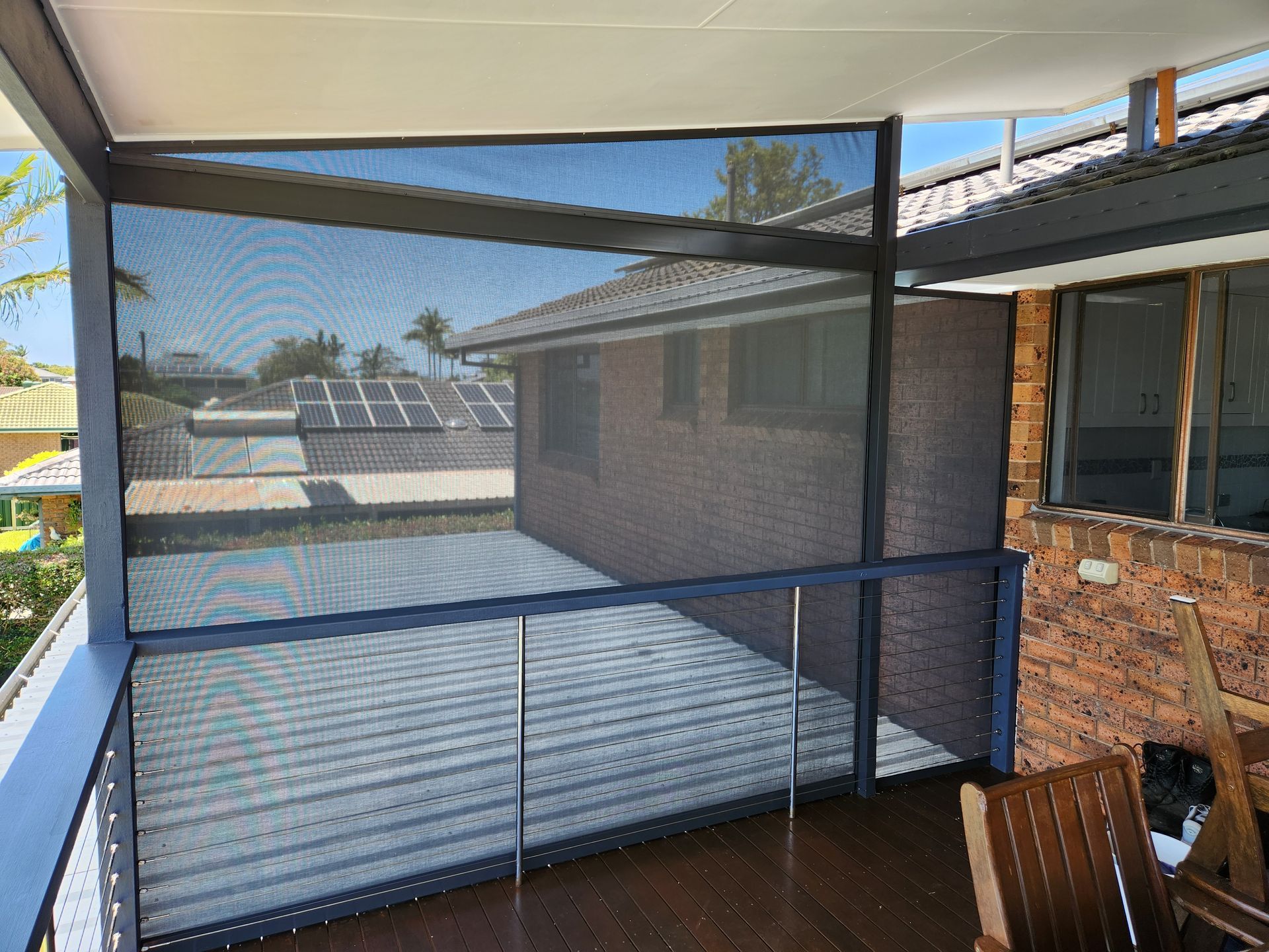 Zipscreen with infill on a timber patio— Summerland Screens & Awnings In Ballina, NSW