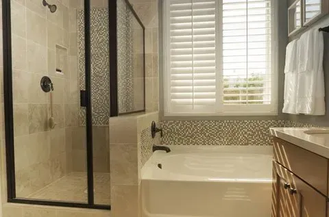 A Bathroom With A Tub , Shower , Sink And Window — Summerland Screens & Awnings In Ballina, NSW