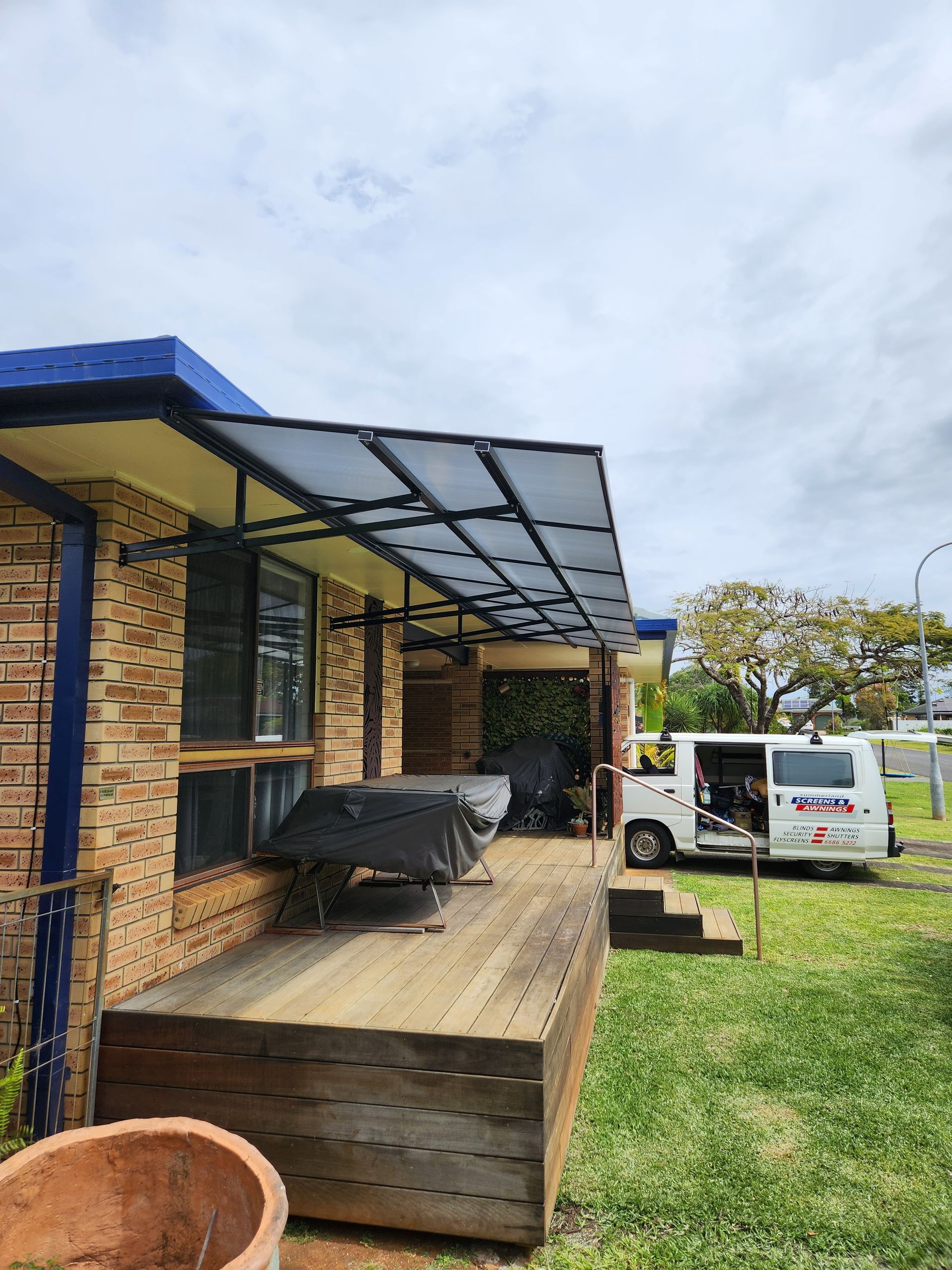 Polycarbonate awning off the side of a house— Summerland Screens & Awnings In Ballina, NSW