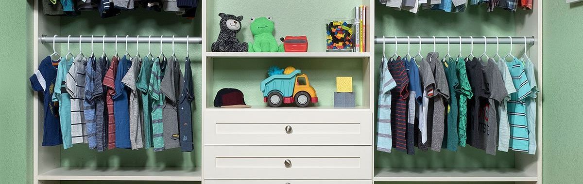 A child 's closet filled with clothes and toys.