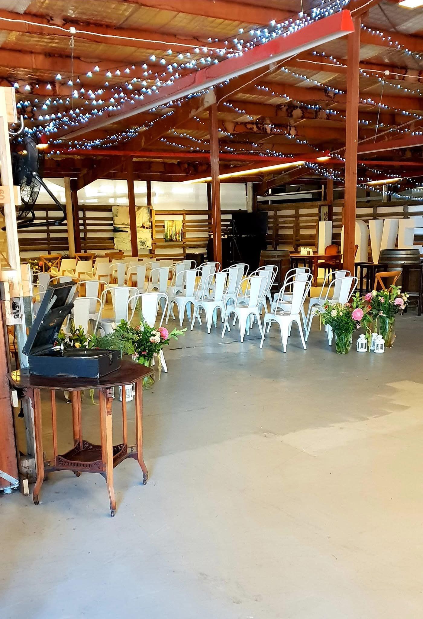 Event Space Set Up for a Ceremony With White Chairs — Rustique on the Coast In Ourimbah, NSW