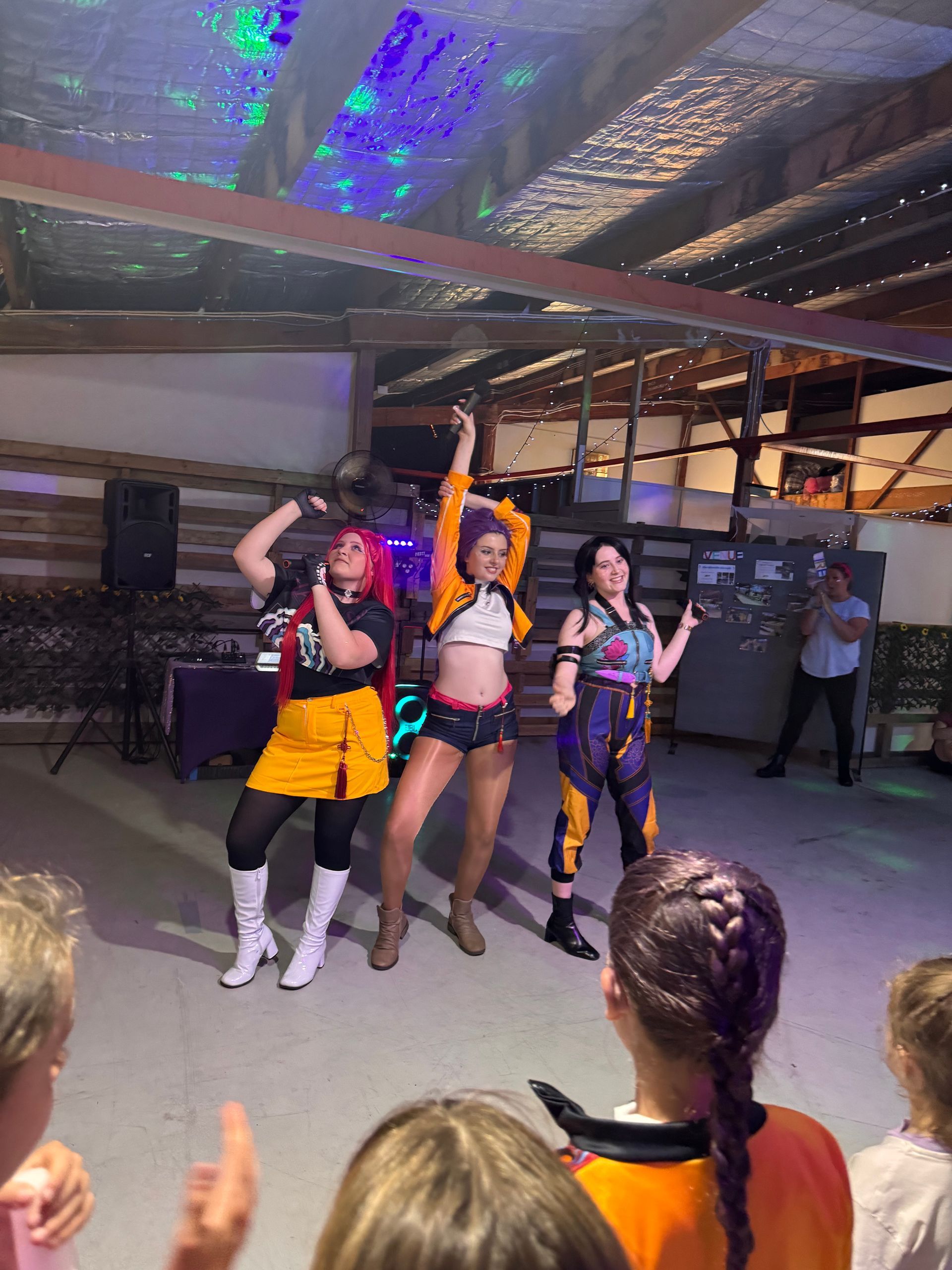 Three Women Dressed in Colorful Costumes Dance Energetically — Rustique on the Coast In Ourimbah, NSW