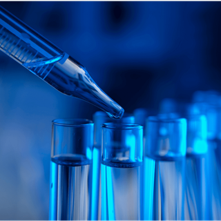 A blue-tinted laboratory scene. A pipette dispenses liquid into a test tube. Other tubes are in the background.