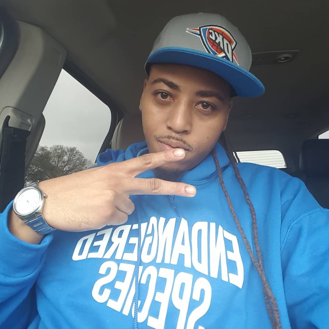 A man wearing a blue hoodie with the number 23 on it