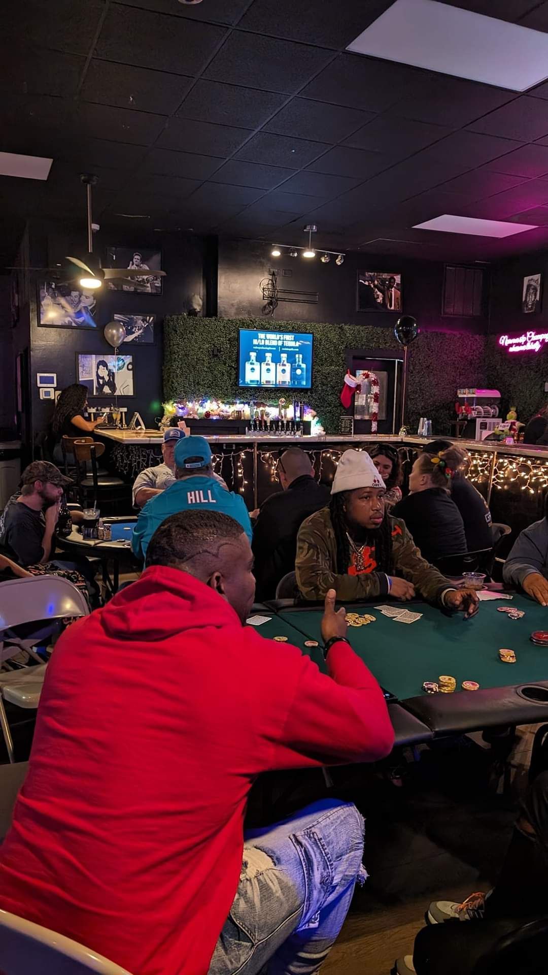 A group of people are playing poker in a casino.