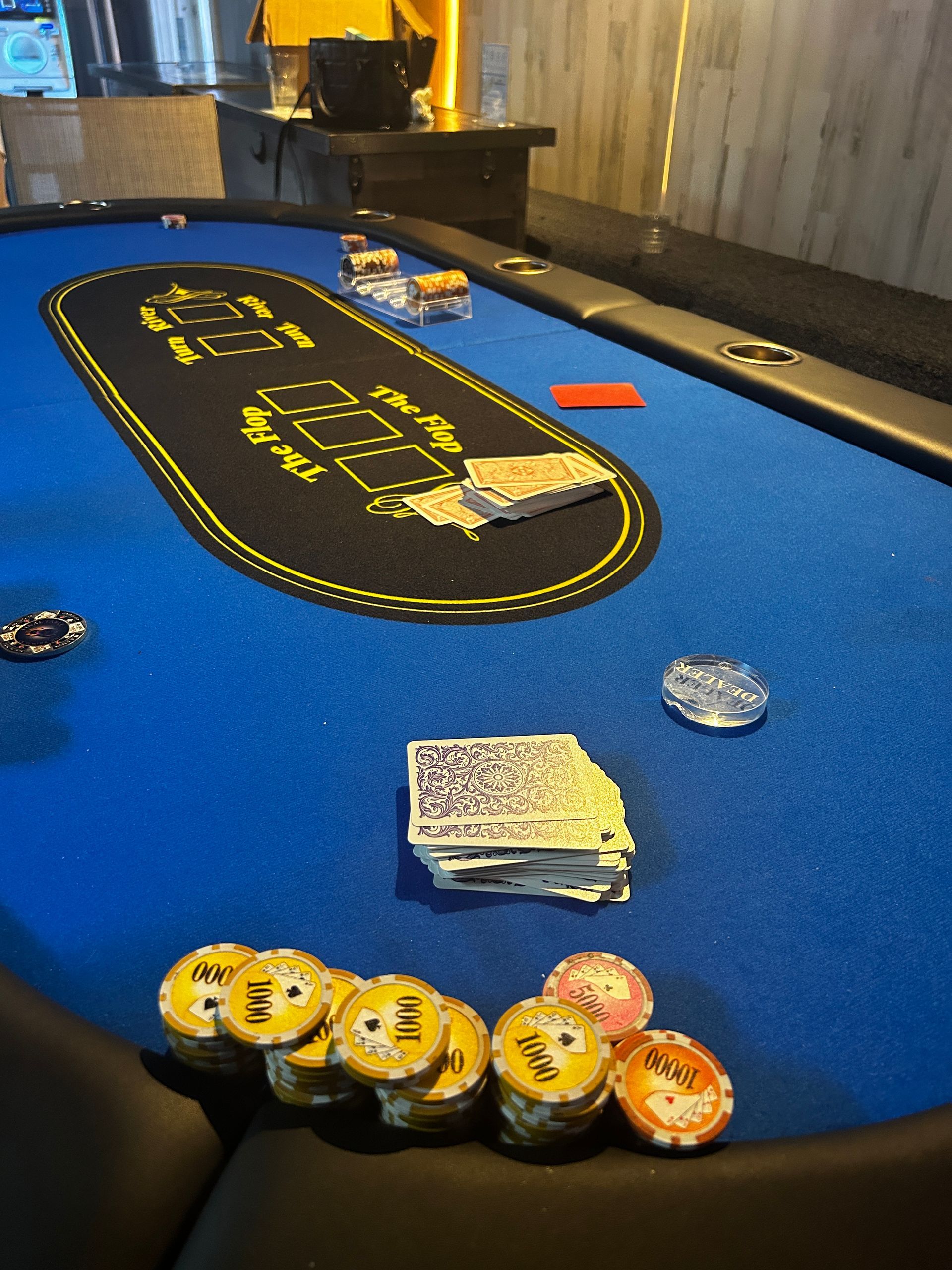 A poker table with cards and chips on it