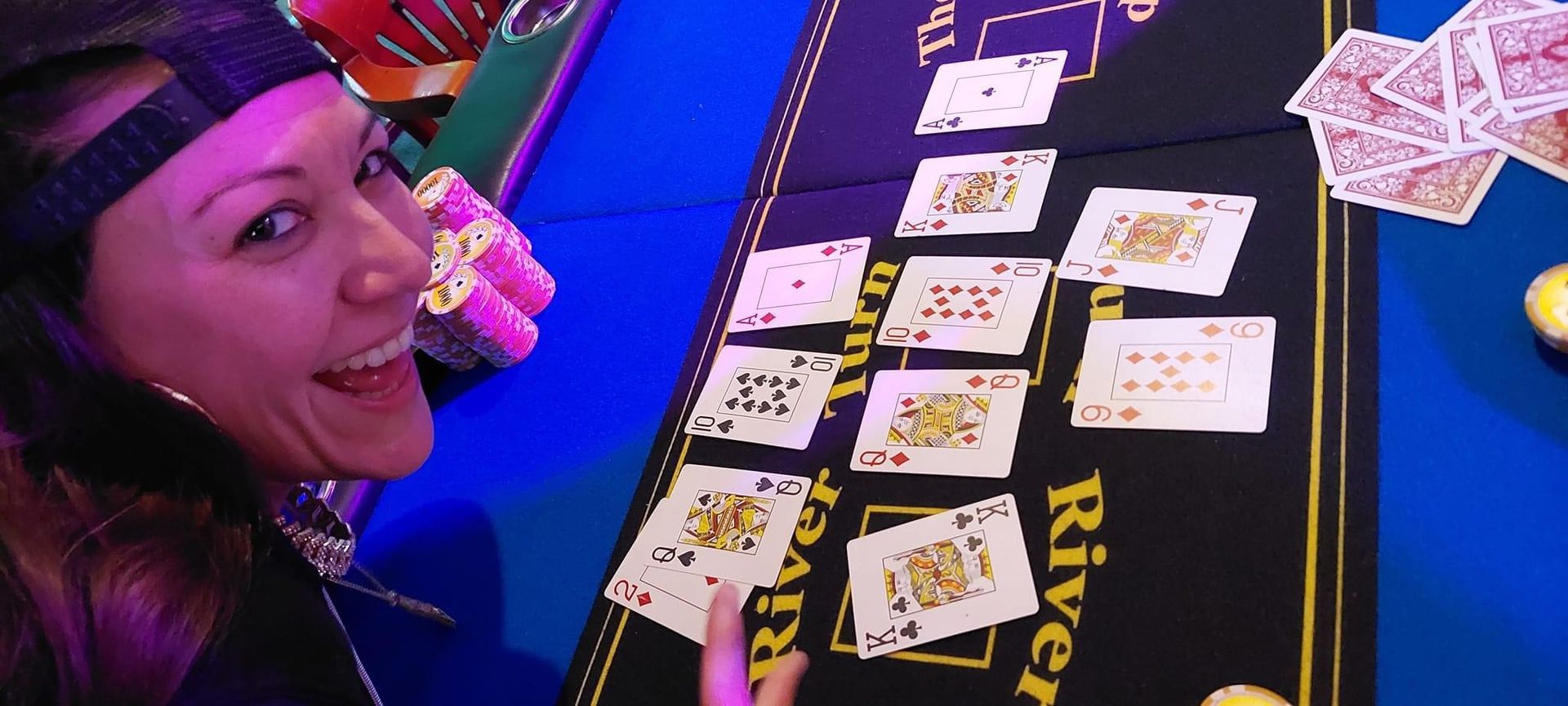 A woman is playing a game of river cards