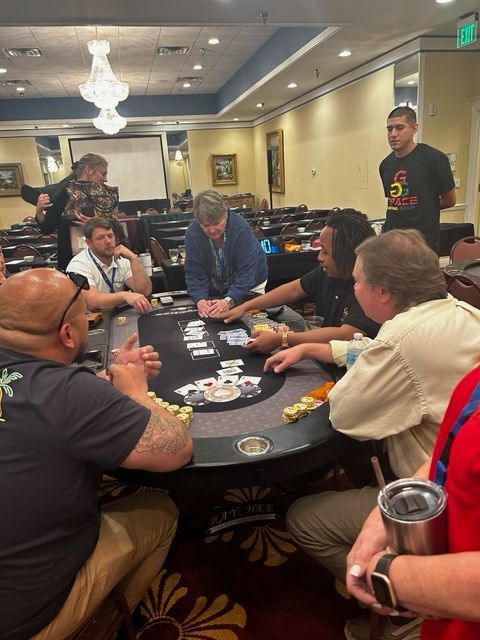 A group of men are playing a game of poker