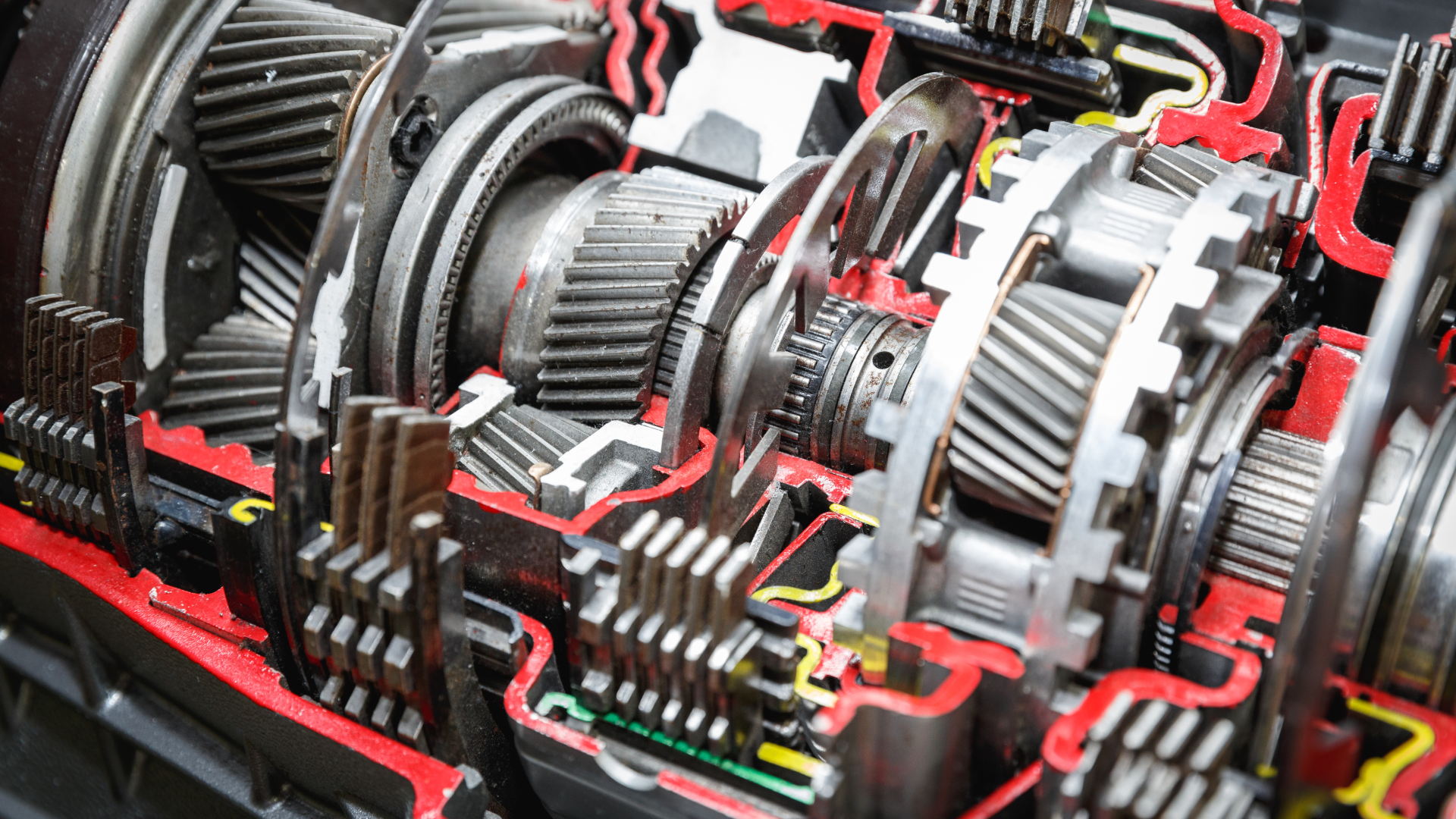 A cut in half model of a car engine on display