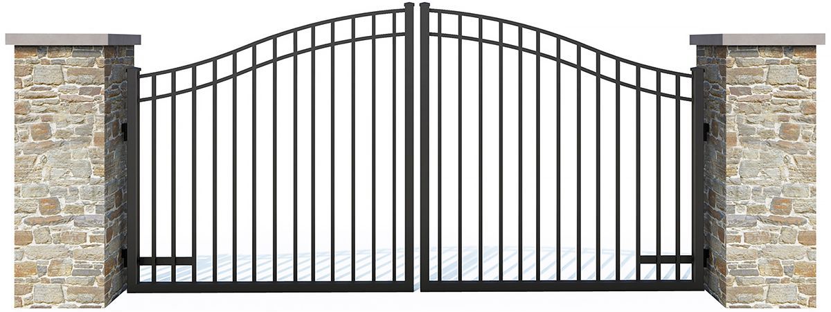 A black metal gate is sitting next to a stone wall.
