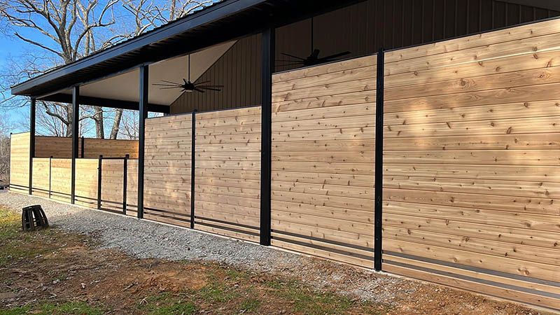 Wood in Clever, Missouri showing full-length pickets, sturdy posts, and a traditional backyard privacy layout.