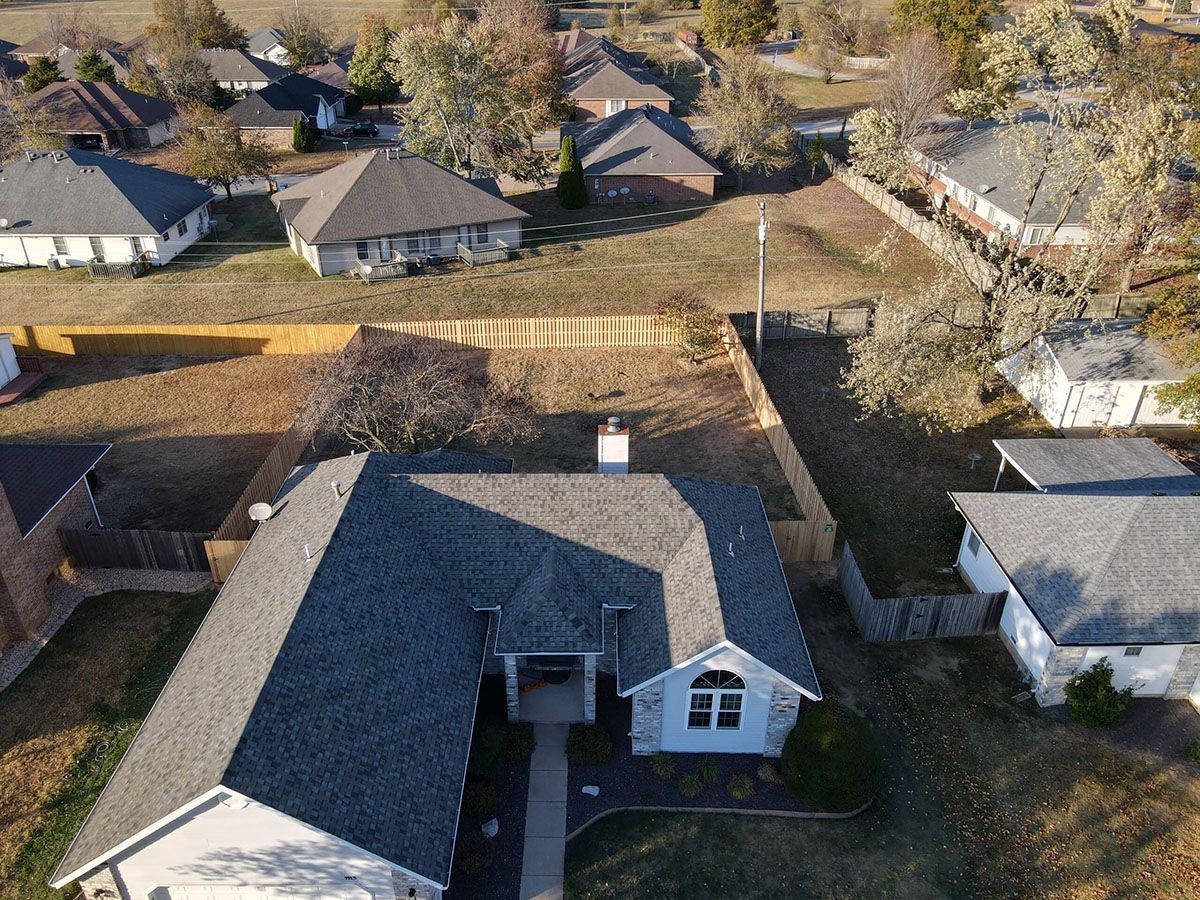 An aerial view of a house in a residential area