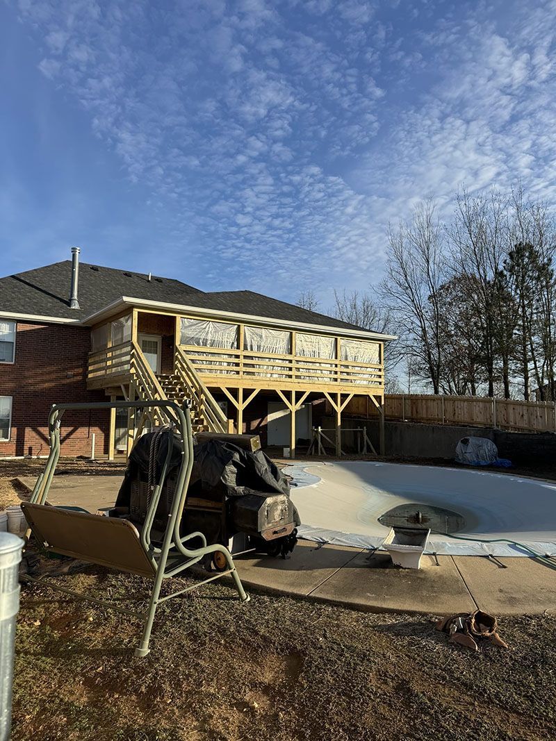 A large house with a swimming pool under construction.