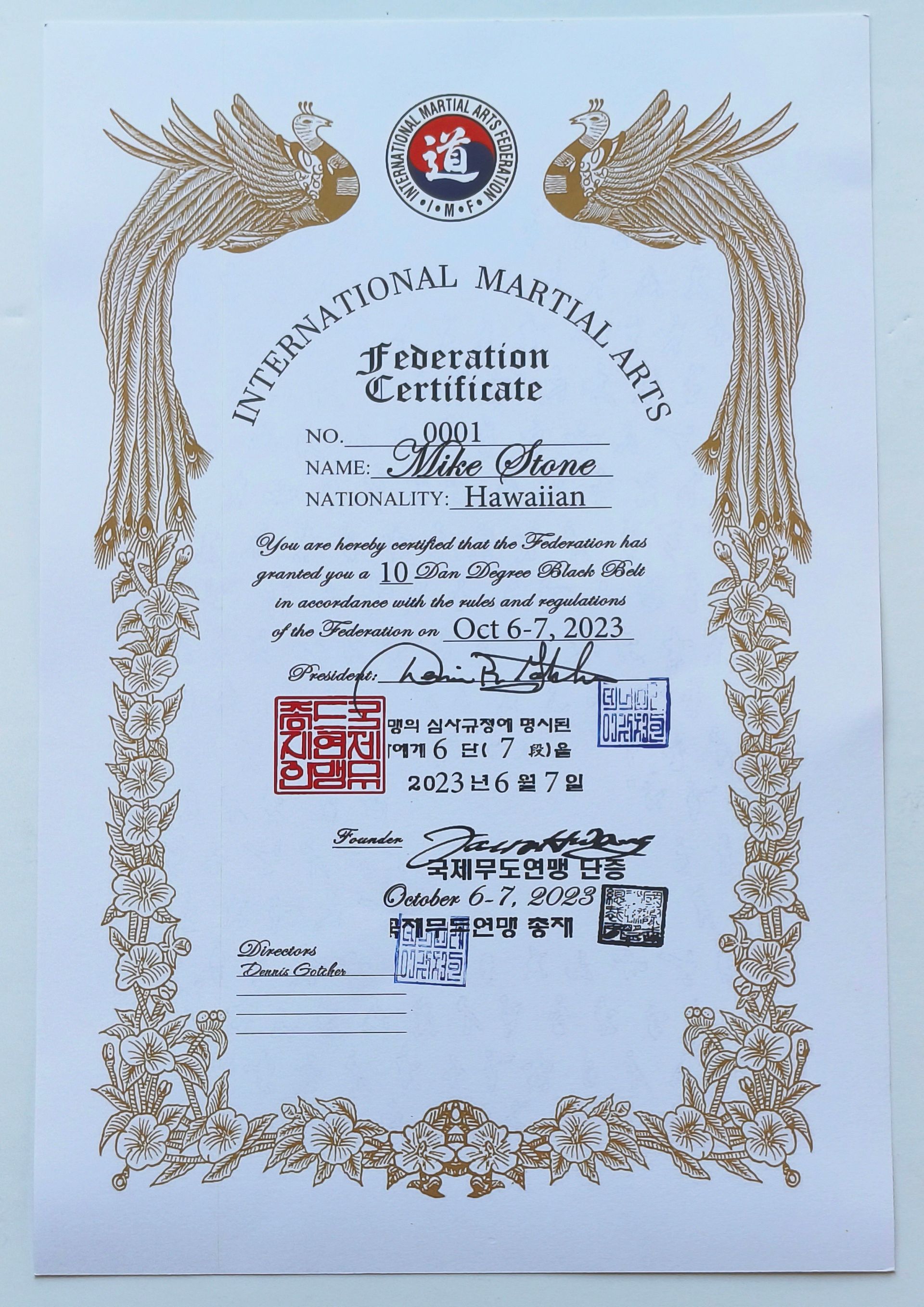 Martial arts certificate with ornate gold dragon frame, red and blue seals, and printed text, including name and date.