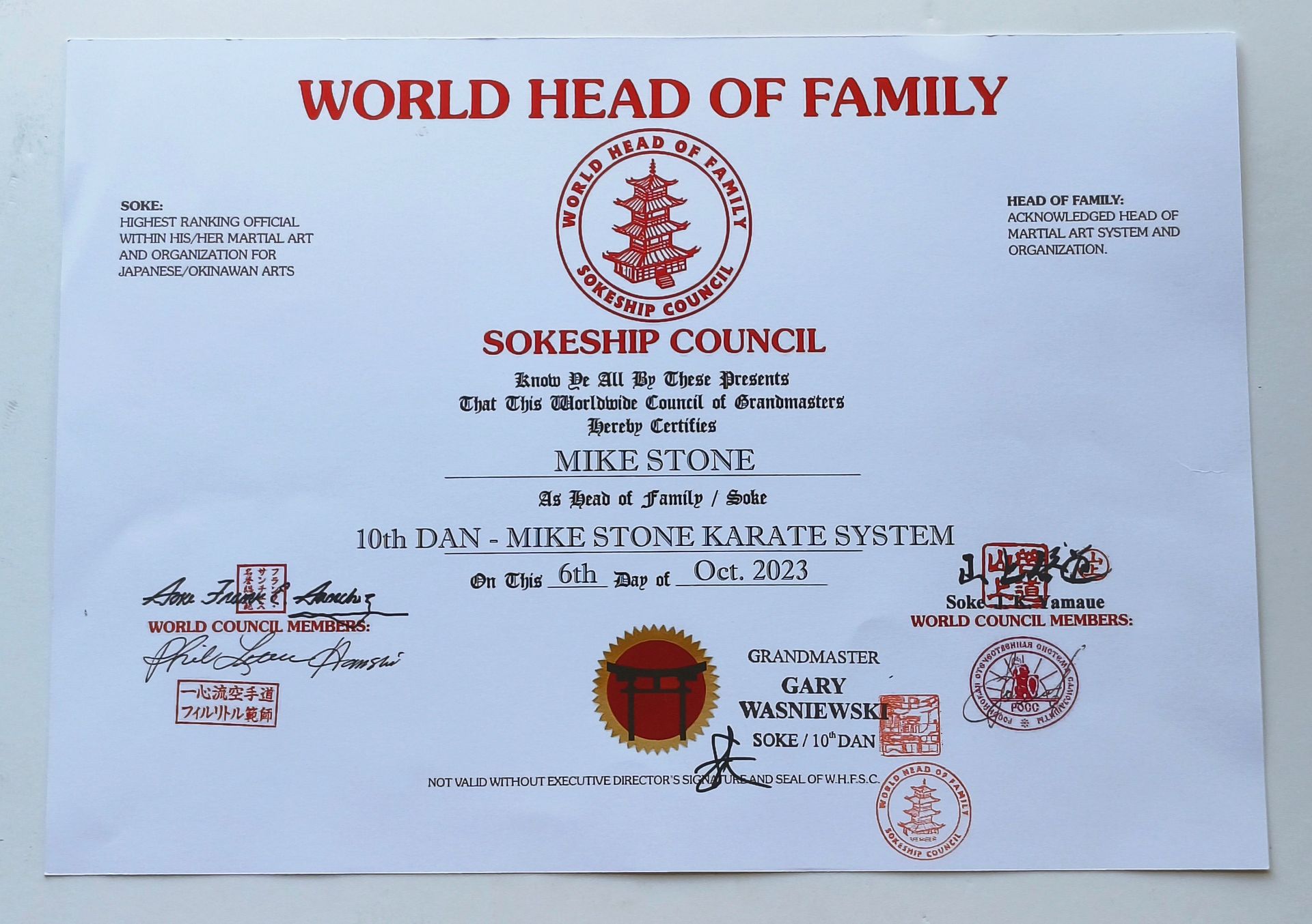 A certificate from the World Head of Family Sokeship Council. The document features text and red seals.