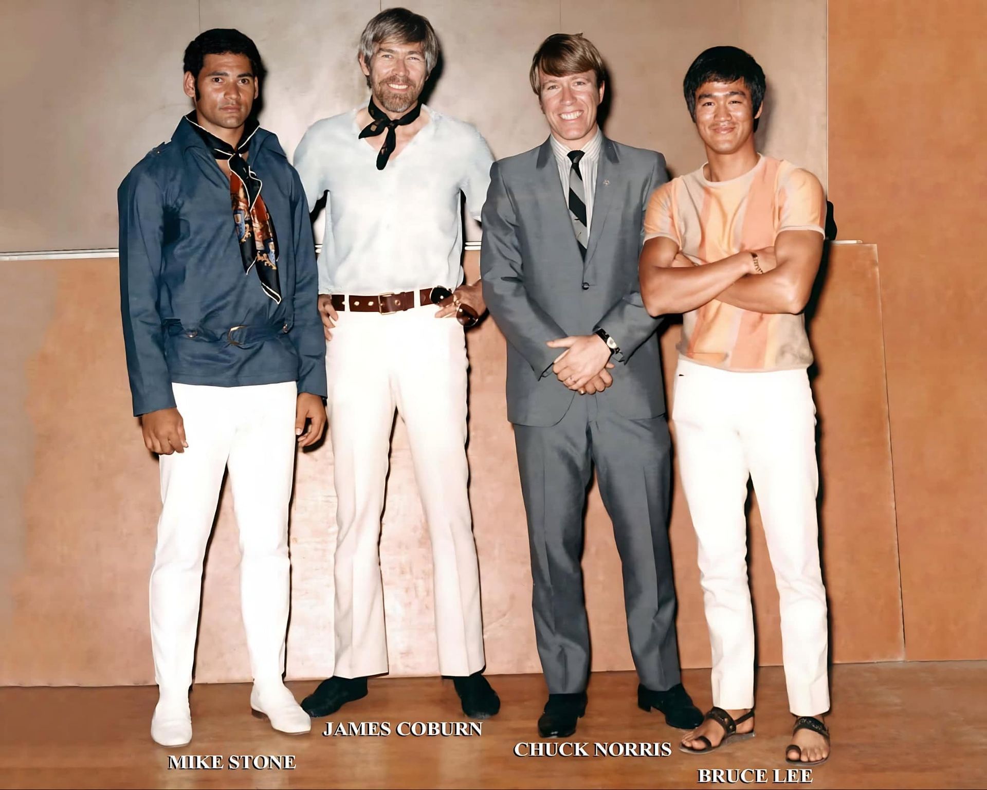 Four men posing together: Jim Brown, James Coburn, Chuck Norris, and Irvin Kershner.