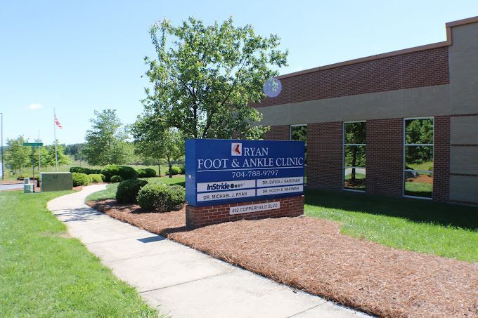 A blue sign for evan foot and ankle clinic