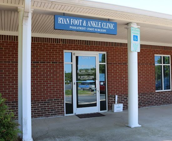 A brick building with a sign that says ryan foot & ankle clinic